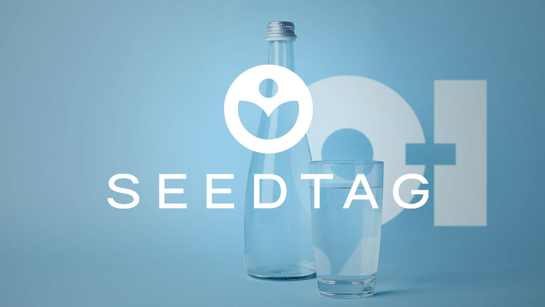 Seedtag logo over a bottle and glass of water